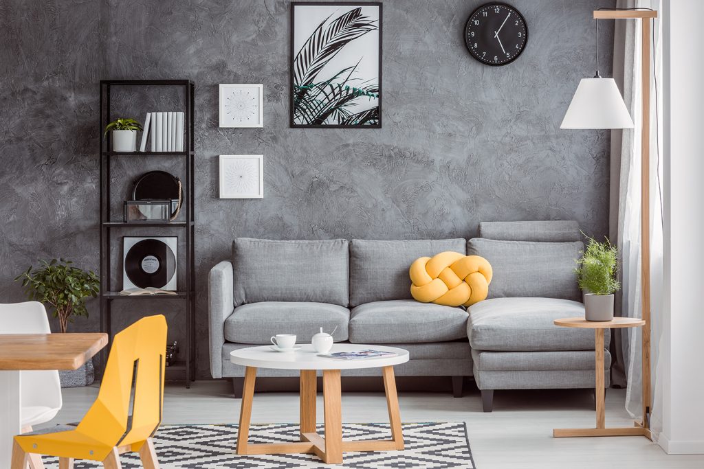 Modern living room with gray decor and yellow accessories